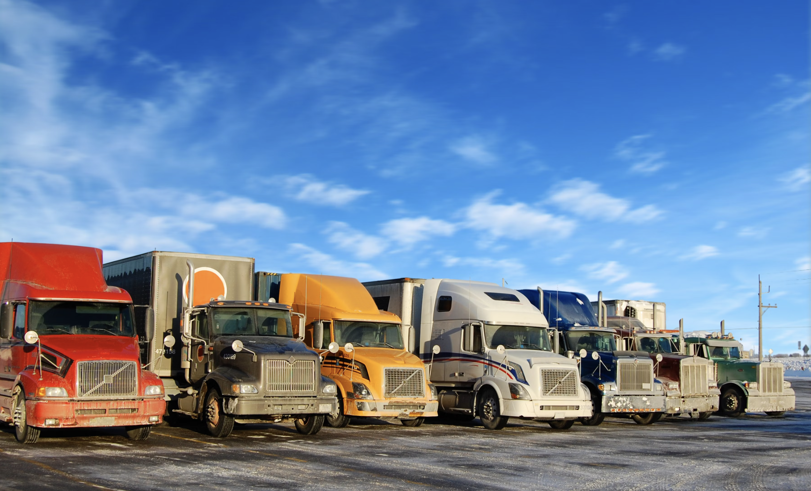 image of row of trucks parked